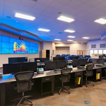 Several desks and workstations inside an emergency services facility.