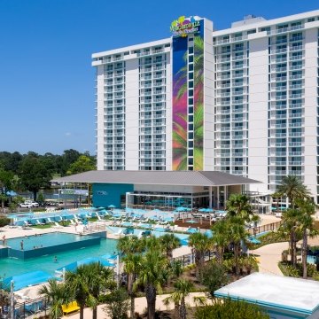 Exterior view of the resort tower with the pool in the foreground 