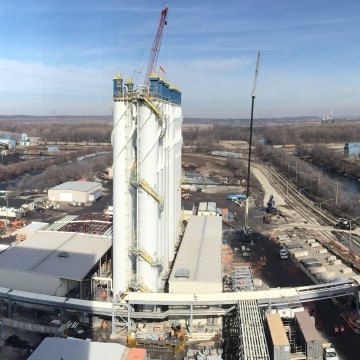 Wide angle outdoor image of the buildings and piping