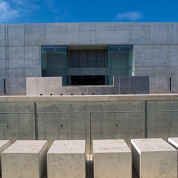 Outdoor entrance to the building that is all concrete