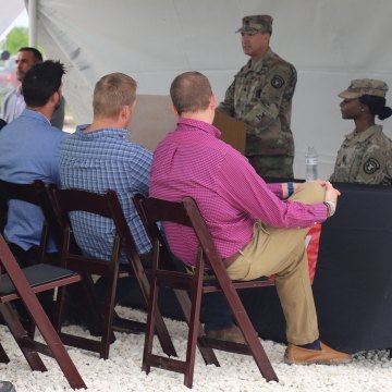 Soldiers talking to an audience.