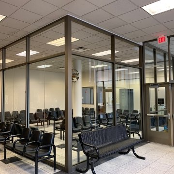 Interior view of a waiting room with chairs.