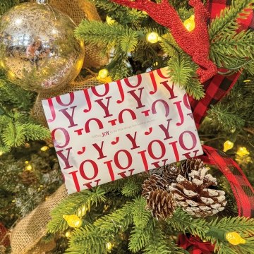 McCarthy-branded holiday card inside a Christmas tree.
