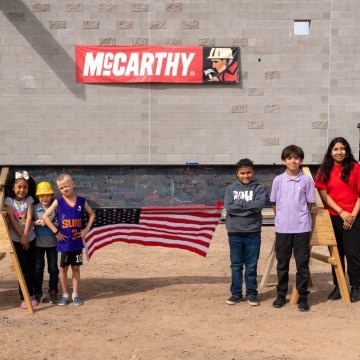 Children from Galveston Elementary standing outside the school