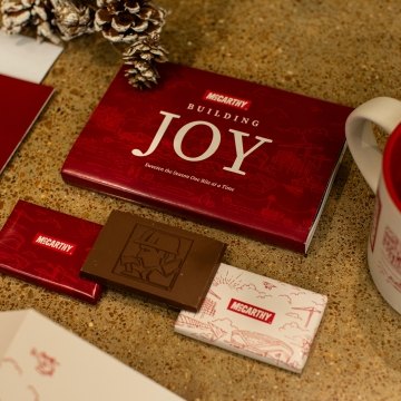 A spread of McCarthy branded holiday goods likes cards and chocolate