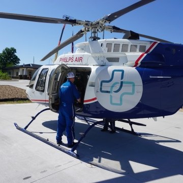 A person looking inside a helicopter