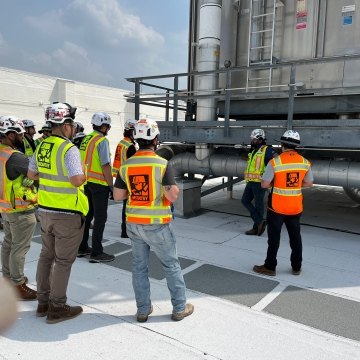 A group of people wearing PPE on a jobsite.