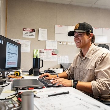 A person looking at a computer screen