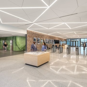 A lobby area with a desk in the middle