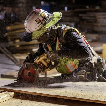 A person using a circular saw