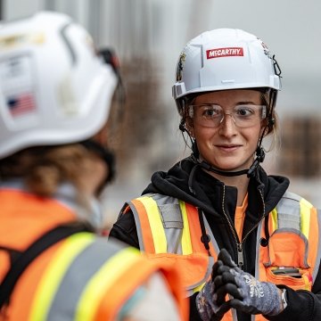 A group of people wearing PPE on a jobsite.