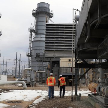 Two people walking on the Ameren Audrain site.