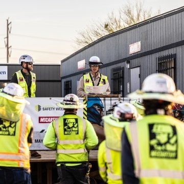 A group of people wearing PPE